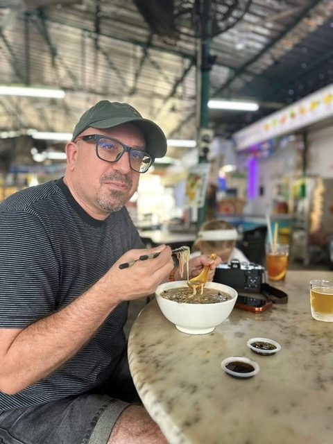 Balazs eating Mee Suah Koh at 33 Best Food Hub